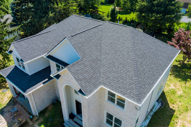 Large estate home with a shingle roof